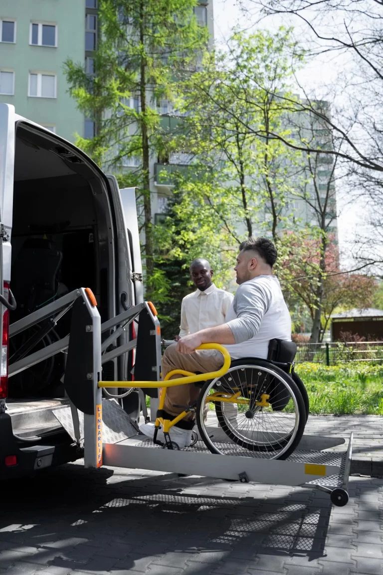 full-shot-disabled-man-getting-van_23-2149445657